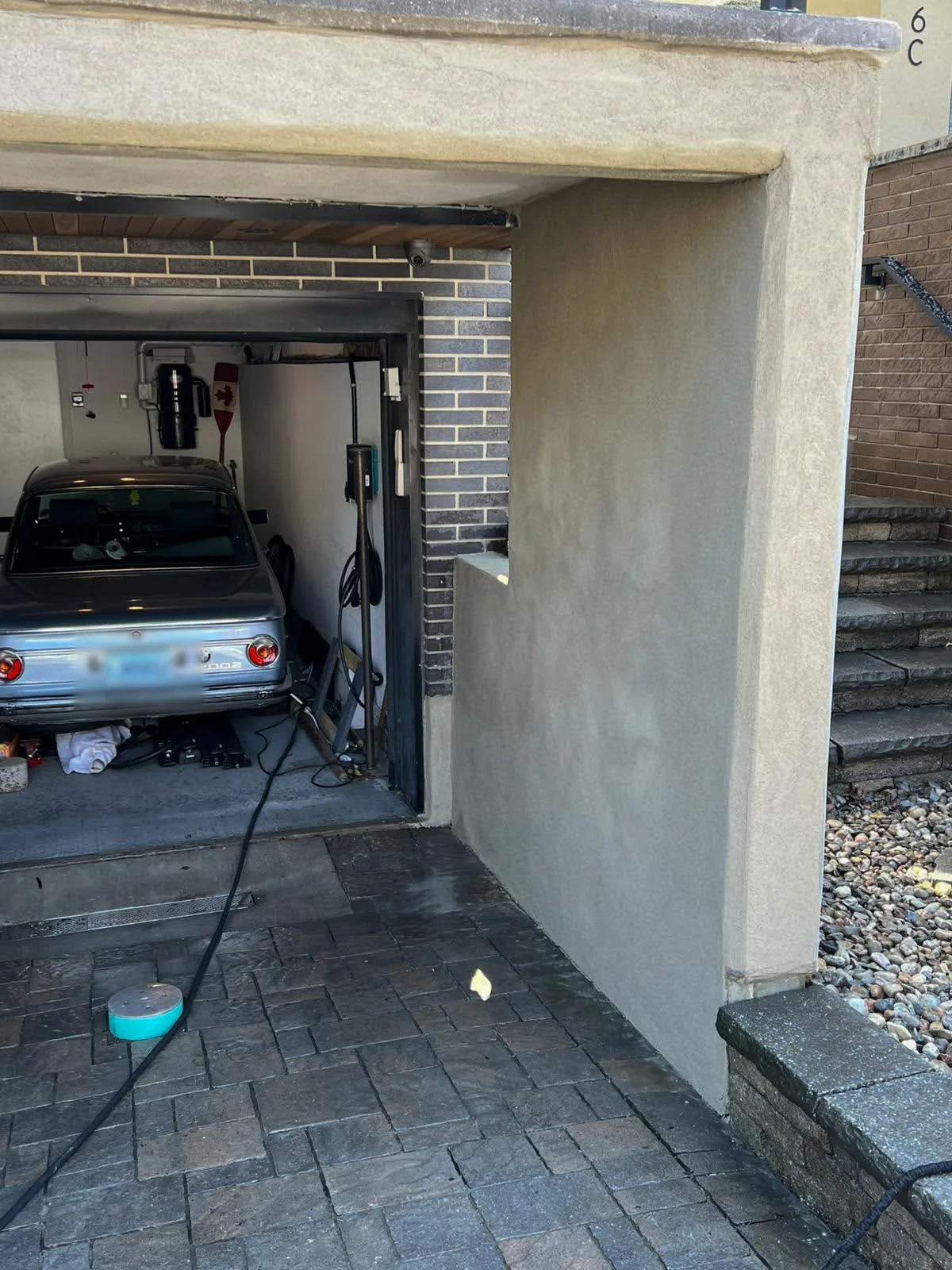 Parged garage wall with a smooth, even finish in Nepean